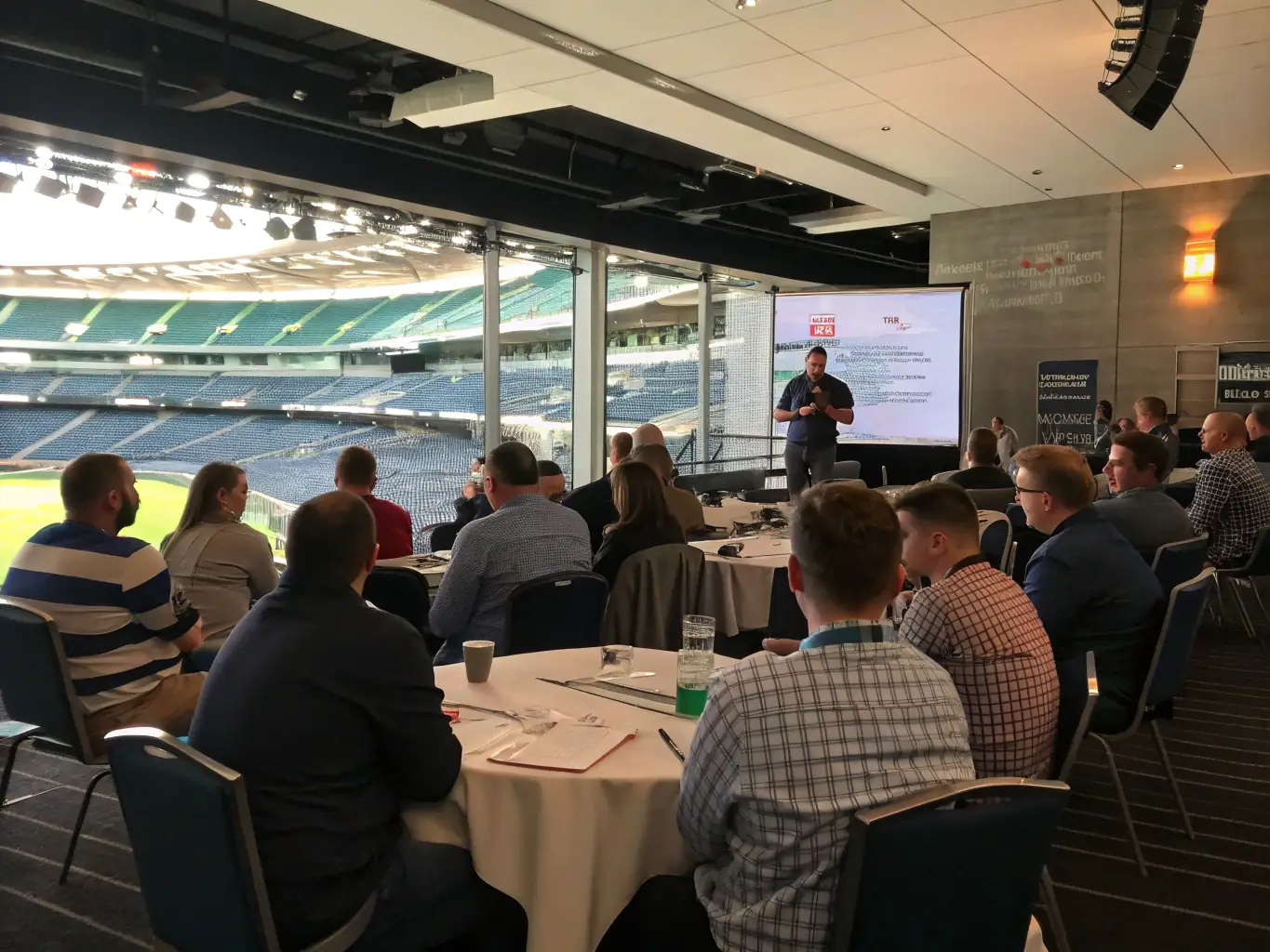 A dynamic shot of attendees actively participating in a workshop session at a LeaConnectSum conference, showcasing collaborative learning and engagement.